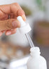 JUVITUS 1 oz Opal White Glass Boston Round Bottle with White Dropper, 24 Pack + Funnel