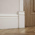 2 1/2"W 6 1/2"H 1"P x x Americraft Solid Paint Grade Wood Traditional Plinth Block, Primed Pine