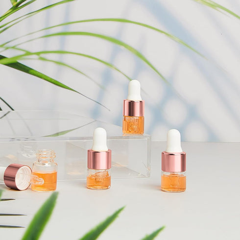 100 Pcs Mini Glass Dropper Bottles, Clear Essential Oil Sample Containers, 1 ml with Cap for Traveling (Rose Gold)