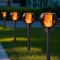 Dynaming 4 Pack Solar Torch Lights Outdoor, Flickering Flame Christmas Pathway Solar