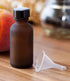 JUVITUS 1 oz / 30 ml Frosted Amber Glass Boston Round Bottle, Airtight Phenolic Cap, 24 Pack + Funnel
