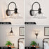 Modern Matte Black Wall Sconce with Glass Shade for Indoor Spaces