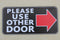 Meijiafei Outdoor/Indoor 4"x8" PLEASE USE OTHER DOOR Sign for Business Store, Shop, Cafe, Office, Restaurant (Arrow